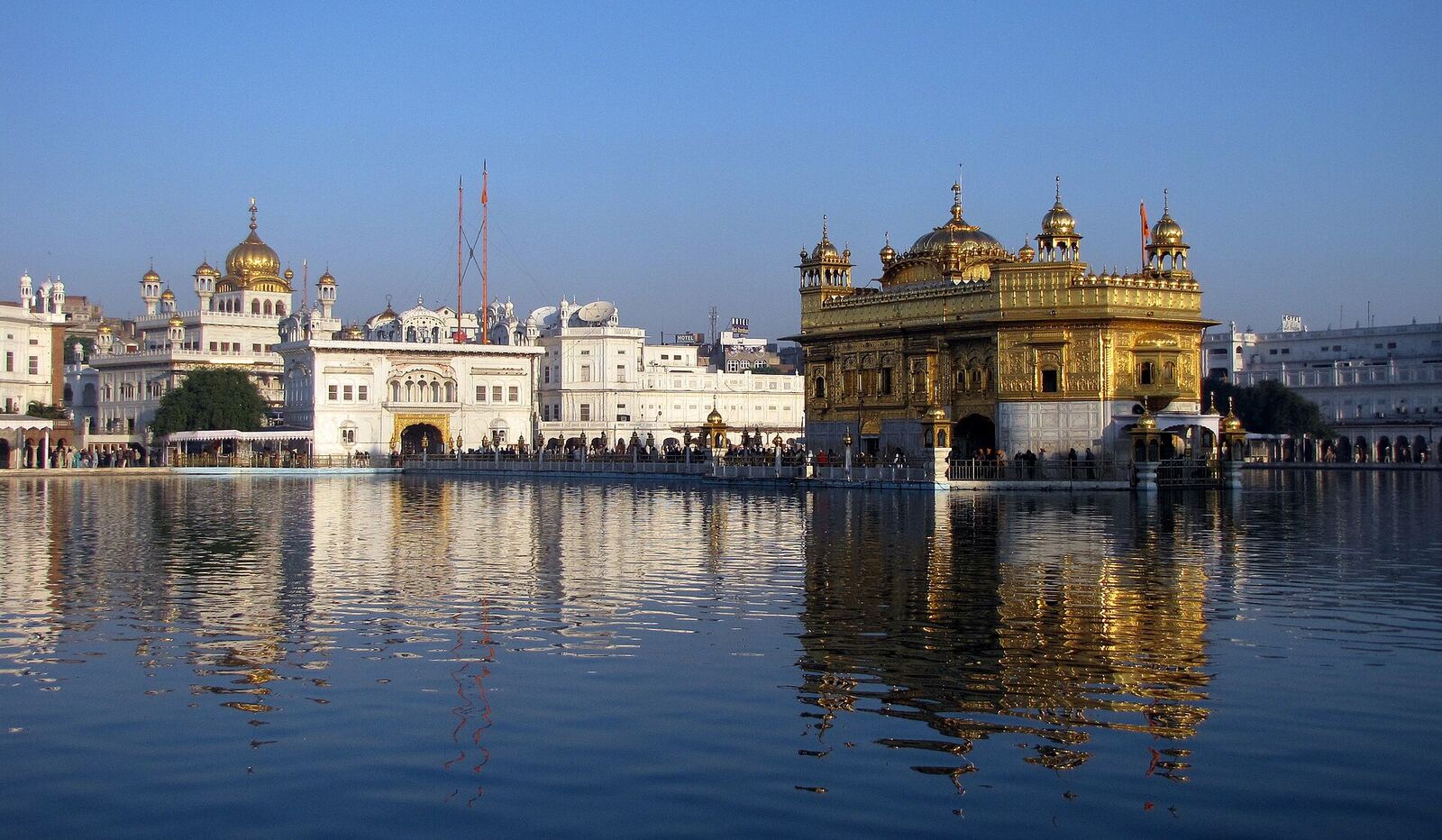 Golden Temple | Sikh Saints The Golden Temple in Amritsar reflects on the holy waters, a central place of worship for Sikhism.