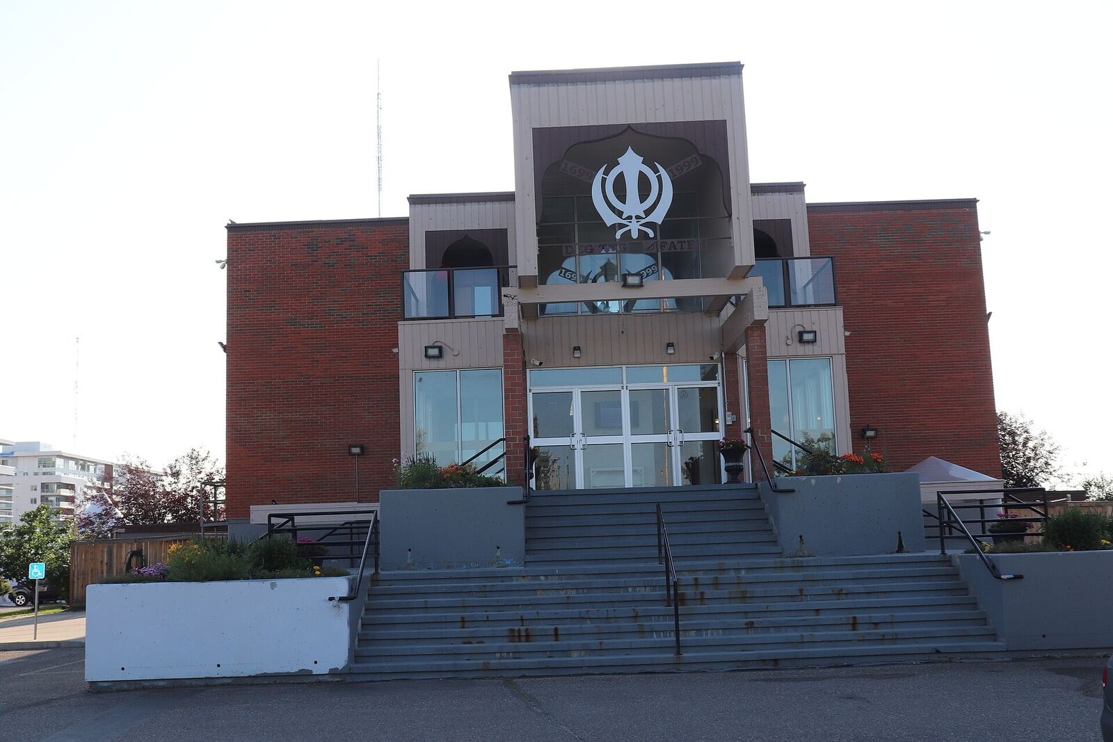 Gurdwara | Sikh Saints A Gurdwara building displays the Khanda symbol, representing Sikh faith and devotion.