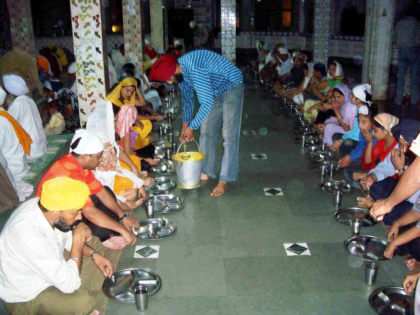 Manikaran Langar | Sikh Saints People share a community meal at the Sikh Gurdwara langar in Manikaran, demonstrating sarbat da bhala.
