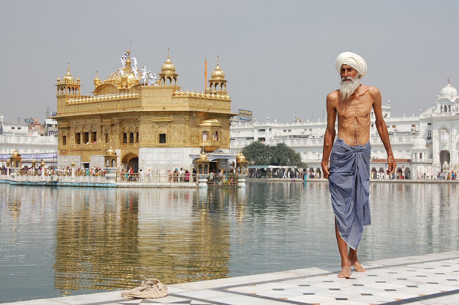 Sikh Pilgrim | Sikh Saints A Sikh pilgrim walks near the Golden Temple in Amritsar, India following a ritual bath.